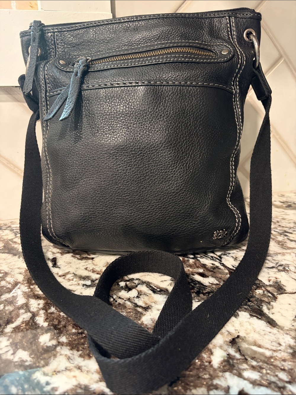 The Sam’s Black Crossbody with Multicolor Patterned Lining
